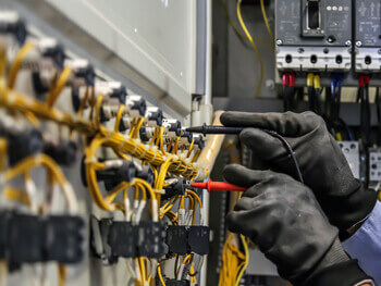 View on an electrician working on low-voltage services